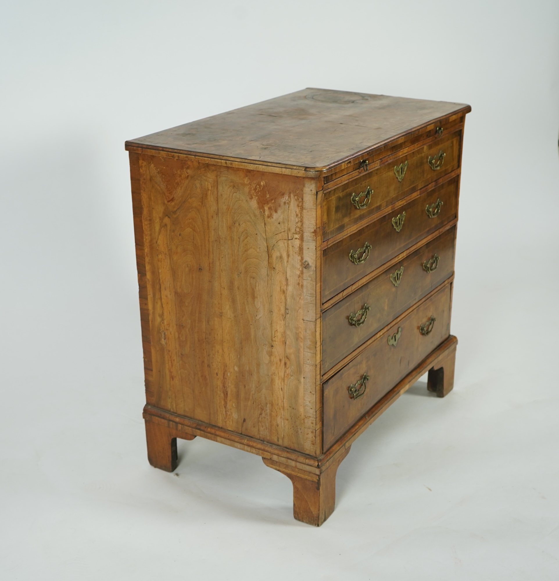 A small George I feather banded walnut chest